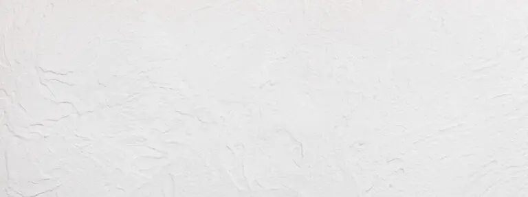 Handgemachte Textur der weißen Betonwand